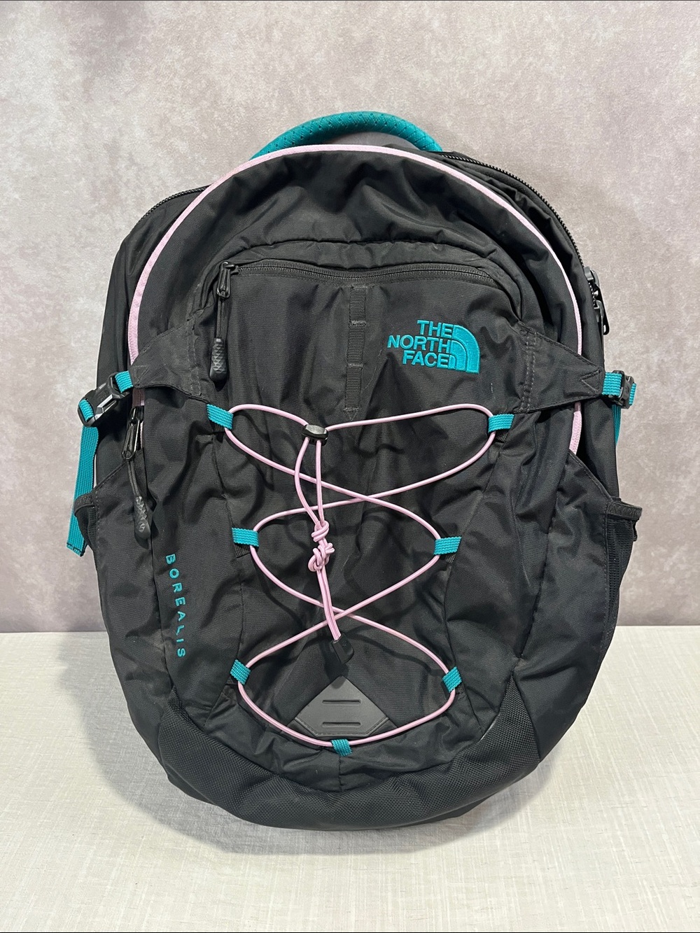 The North Face Borealis Backpack in Black with Teal & Pink Accents